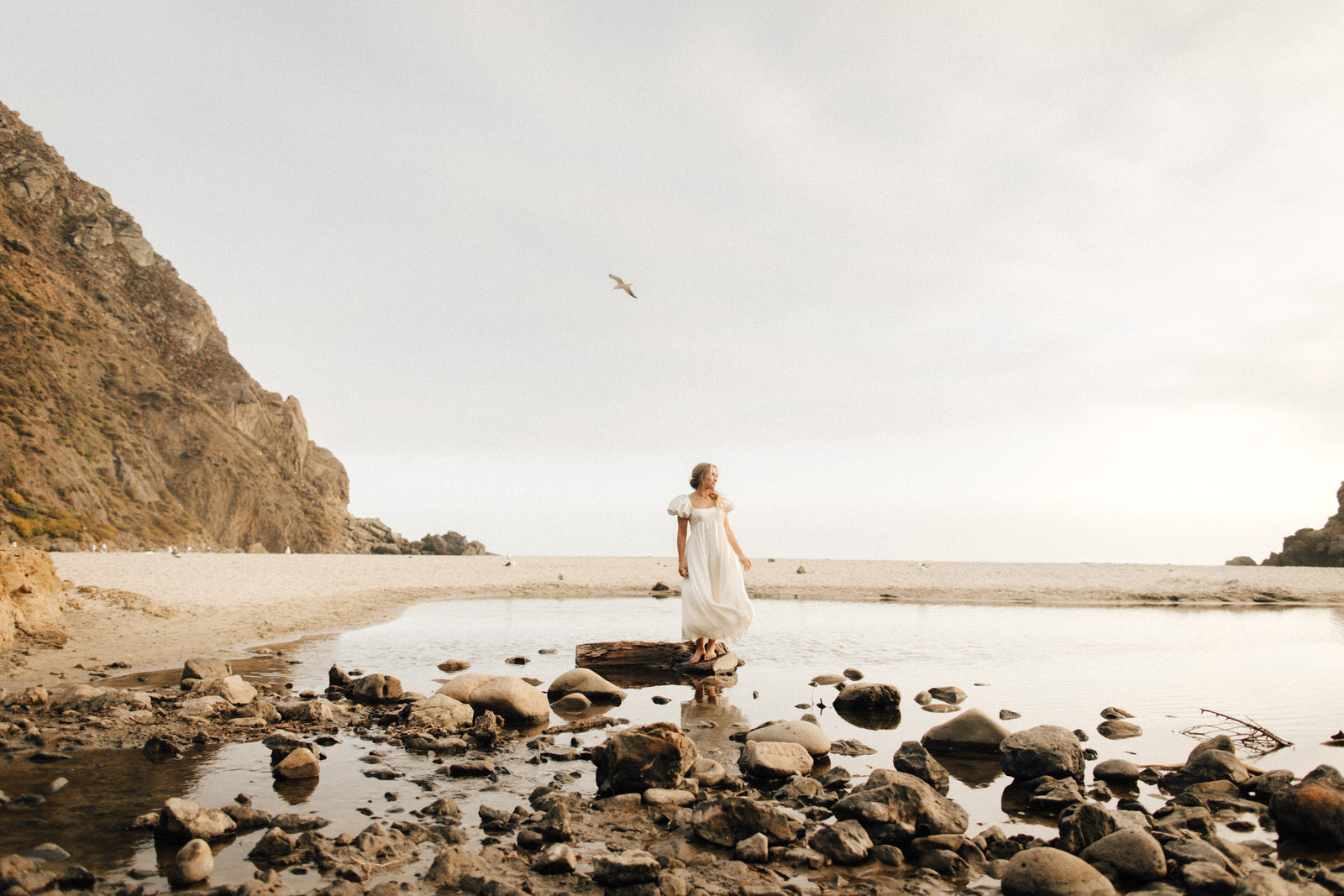 Bride at Pfeiffer Beach on rocks