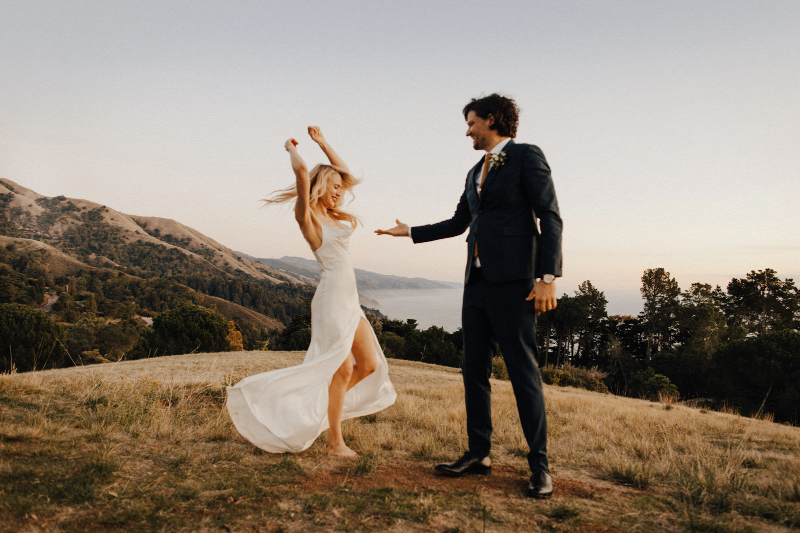 Dancing couple on mountain top in Big Sur